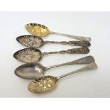 Two Georgian silver gilt repousse berry spoons,