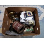 A box of vintage metal tin, brass lamp,