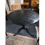 A painted Victorian pedestal tilt topped table