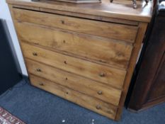 A nineteenth century elm five drawer chest