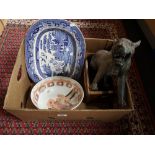 A nineteenth century blue and white meat plate, decorative tiger figure, wooden bottle rack,