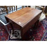 A nineteenth century oak flap sided table