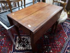 A nineteenth century oak flap sided table
