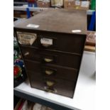 A mid century metal five drawer desk chest