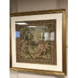 A gilt framed tapestry - lovers in a garden