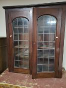 A Victorian glazed double door bookcase