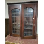 A Victorian glazed double door bookcase