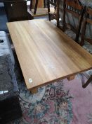 A contemporary solid oak coffee table
