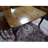 A reproduction early twentieth century extending dining table