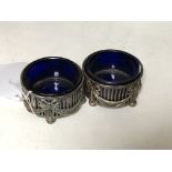 A pair of Neo-Classical silver salts with blue glass liners.