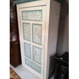 A rustic painted pine cabinet