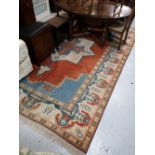 A fringed Eastern carpet,