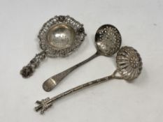 Three silver strainers