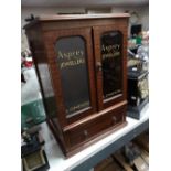 A reproduction mahogany jewellery cabinet with Asprey advertising decoration