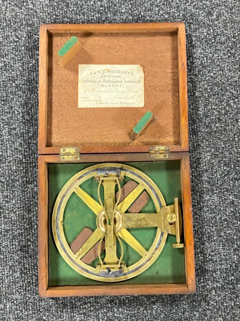 An antique brass surveying instrument by J and W Archbutt in fitted box