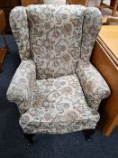 An early twentieth century armchair in floral fabric