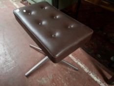 A mid century button vinyl stool on chrome base.