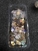 A quantity of pin badges,