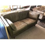 A mid century tan leather two seater settee.