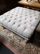 A contemporary studded upholstered oversized footstool CONDITION REPORT: 87cm by