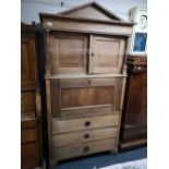 A nineteenth century oak secretaire cabinet