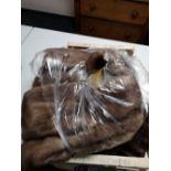 Two fur wraps and two mink coats