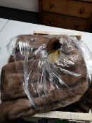 Two fur wraps and two mink coats