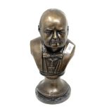 A metal bust : Winston S. Churchill, on circular marble base, overall height 34 cm.