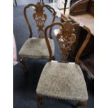 A pair of oak dining chairs