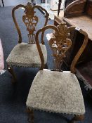 A pair of oak dining chairs