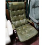 A green studded leather adjustable relaxer chair.