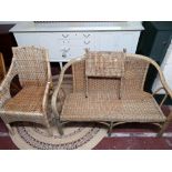 A two seater wicker settee,