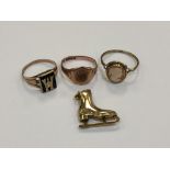 Three 9ct gold rings and a 9ct gold ice skate charm CONDITION REPORT: 10.3g gross.