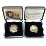 Two silver proof two-pound coins,