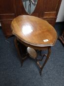 An Edwardian oval occasional table