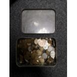 A tin of coins,