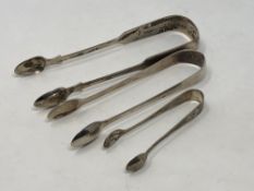 A pair of Georgian silver sugar tongs and two silver Victorian pairs (3) CONDITION