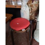 Three mid century stacking stools and a corded rug.