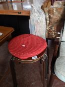 Three mid century stacking stools and a corded rug.