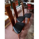 A contemporary extending dining room table and six chairs.