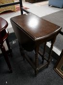 An Edwardian flap sided table