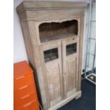 A continental light oak hall cabinet with glazed panel doors CONDITION REPORT: 93cm