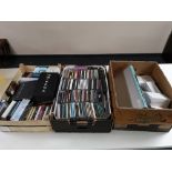 A box of iPhone boxes, remote controls, DVD player,