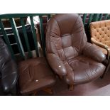 A brown leather relaxer chair with footstool.