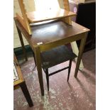 A mid century teak table and a small coffee table.