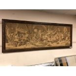 A carved oak framed tapestry depicting a tavern