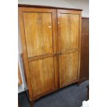 An Edwardian mahogany double door wardrobe