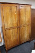 An Edwardian mahogany double door wardrobe