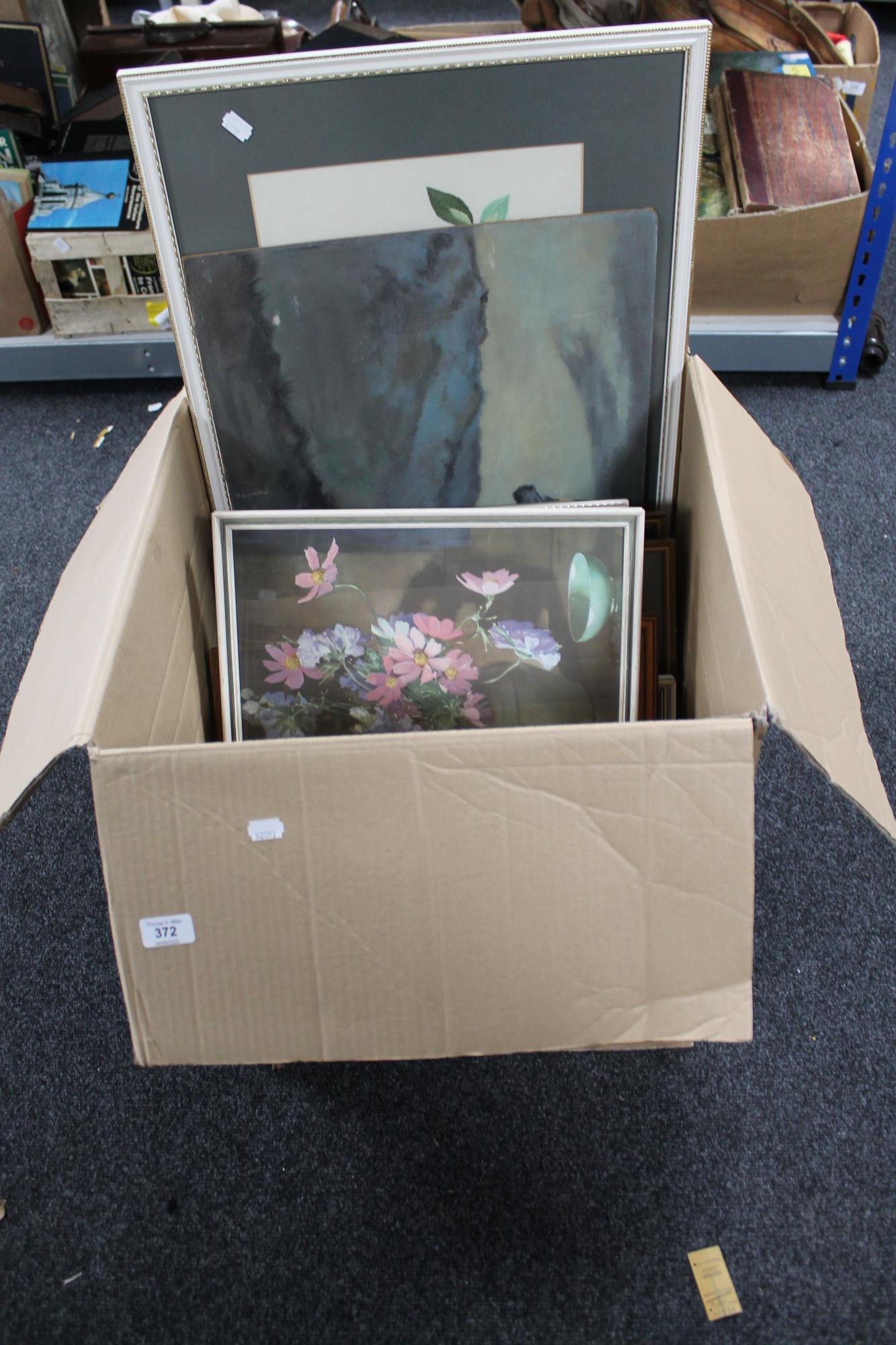 A large box of pictures and prints
