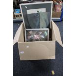 A large box of pictures and prints